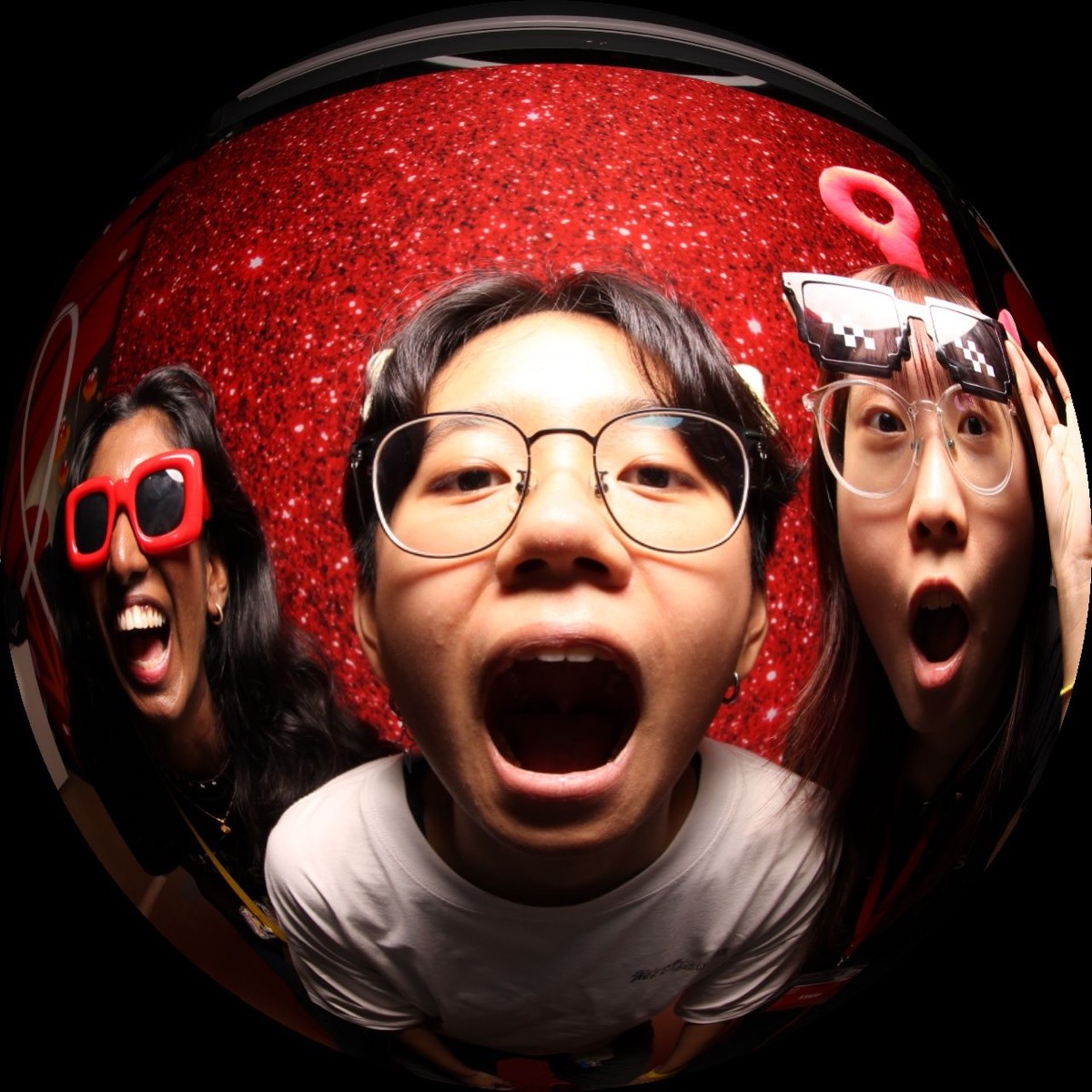 Ultra-wide fisheye photo booth shot of a guest at a Malaysian event